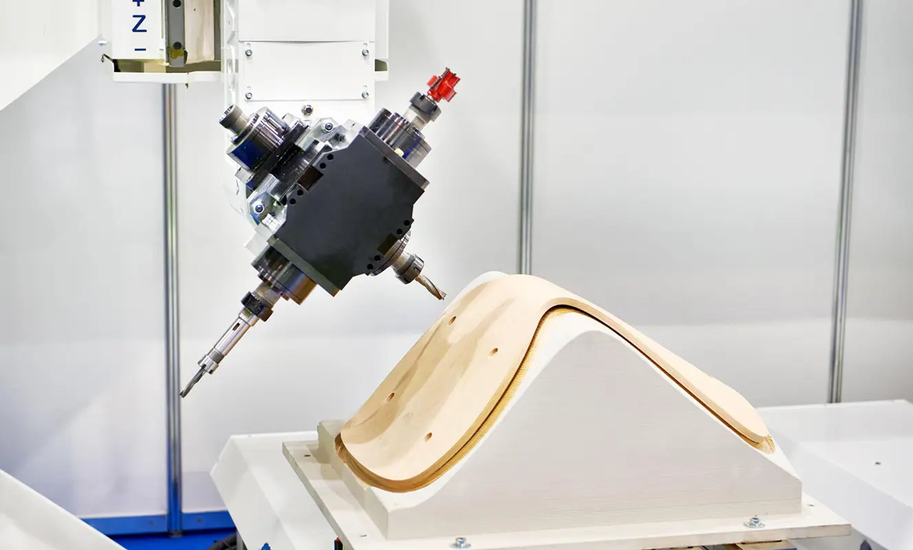 CNC woodworking machine processing wooden chair components with precision, suitable for efficient chair and furniture manufacturing.
