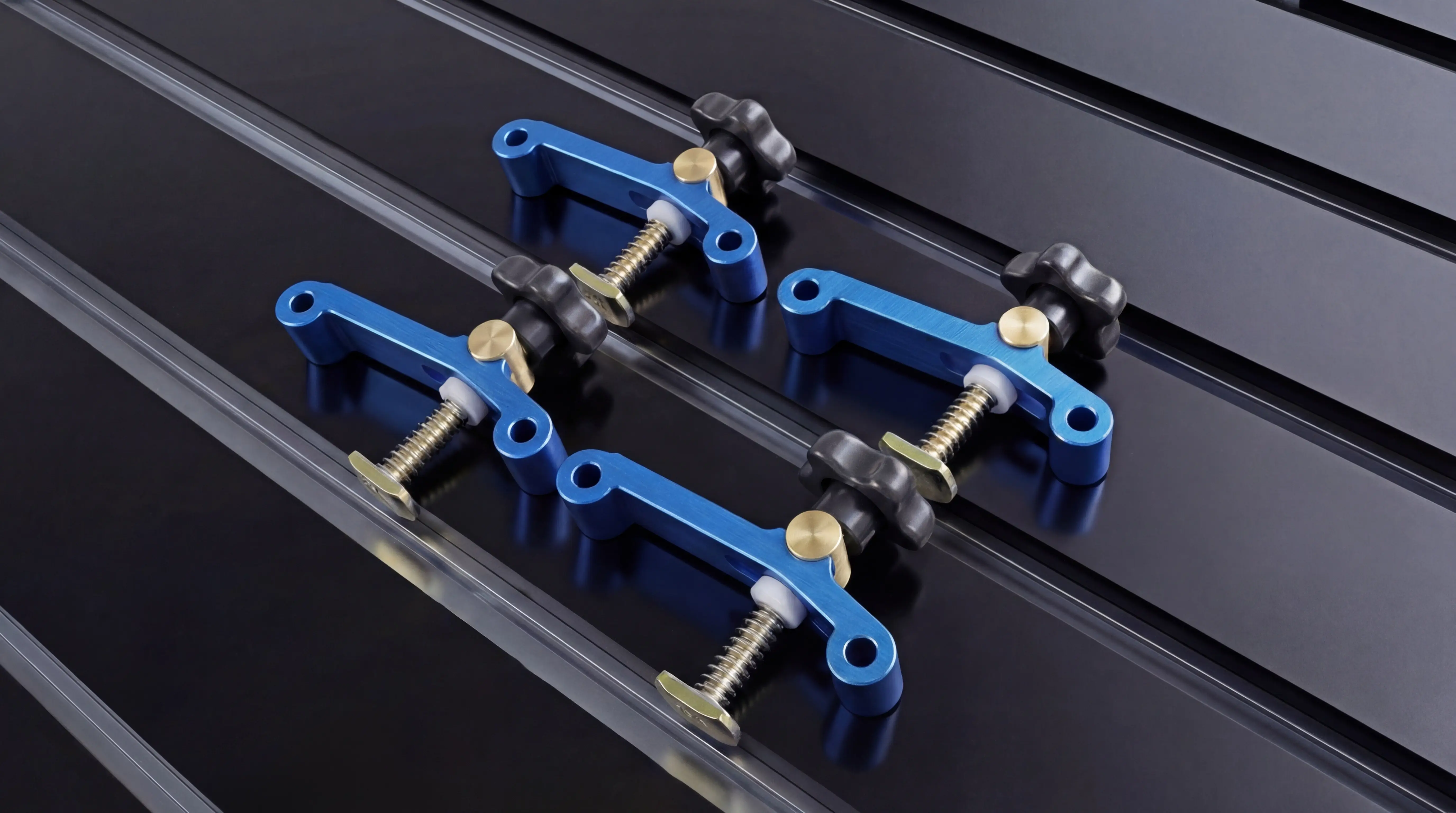 Hold-down clamps for Spire 1325 CNC router with flood cooling