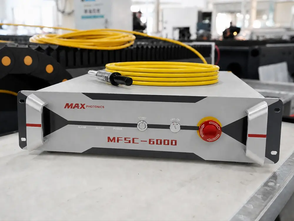 Maxphotonics 6000W fiber laser source Maxphotonics 6000W fiber laser source of the enclosed fiber laser sheet cutting machine with shuttle table