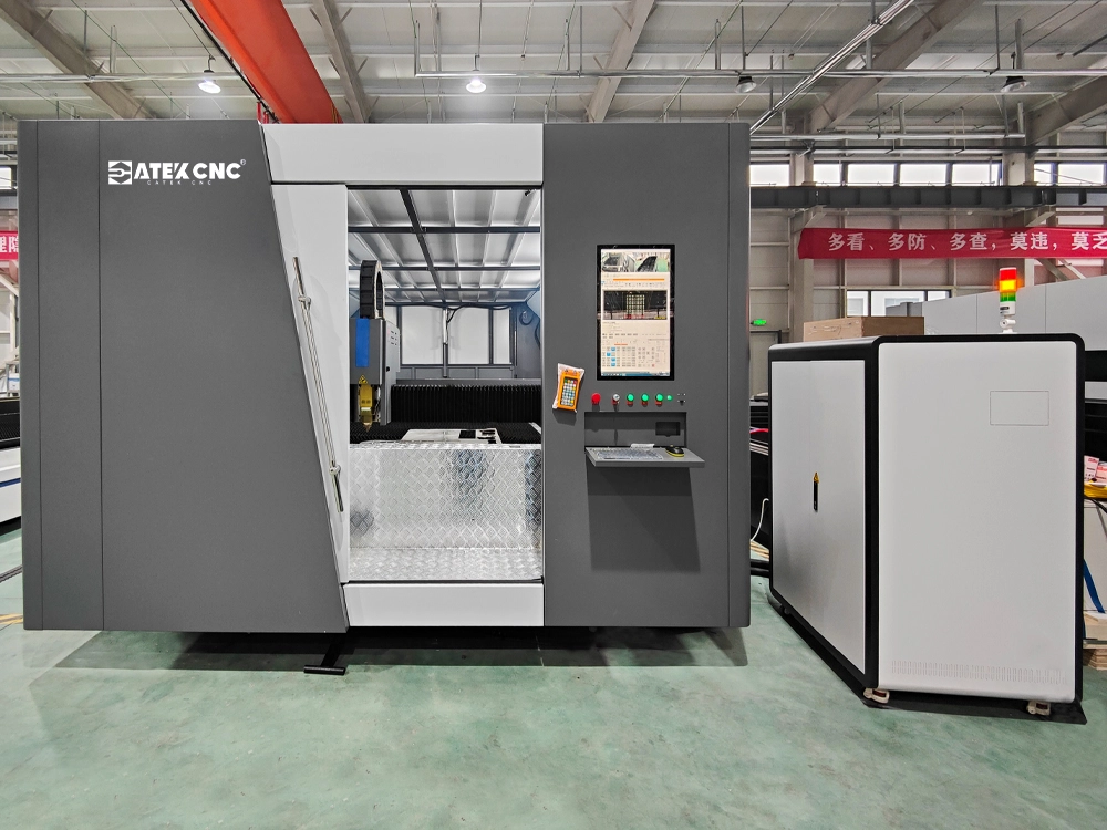 The 2040 enclosed fiber laser cutting machine with dual-shuttle table when the door open The 2040 enclosed fiber laser cutting machine with dual-shuttle table when the door open