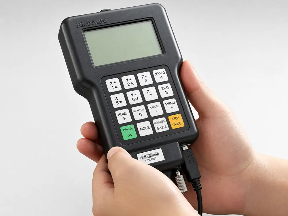 Optional DSP hand controller for a desktop CNC router, enabling convenient offline operation and precise CNC control