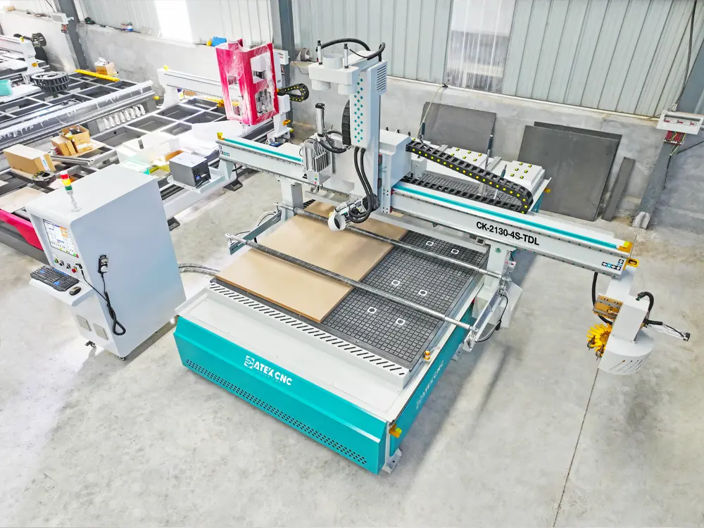 Top view of the 4-axis swivel head ATC CNC router with auto-labeling device and drilling bank Top view of the 4-axis swivel head ATC CNC router with auto-labeling device and drilling bank