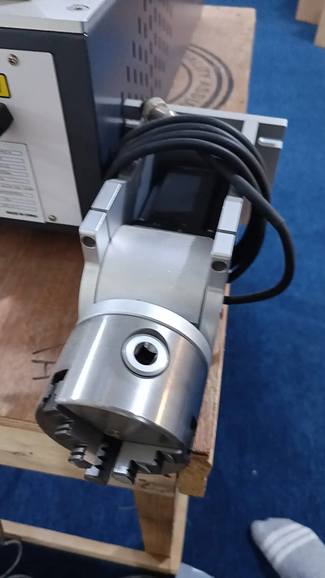 The Tanzanian customers are using UV laser marking machines to mark glass and pens