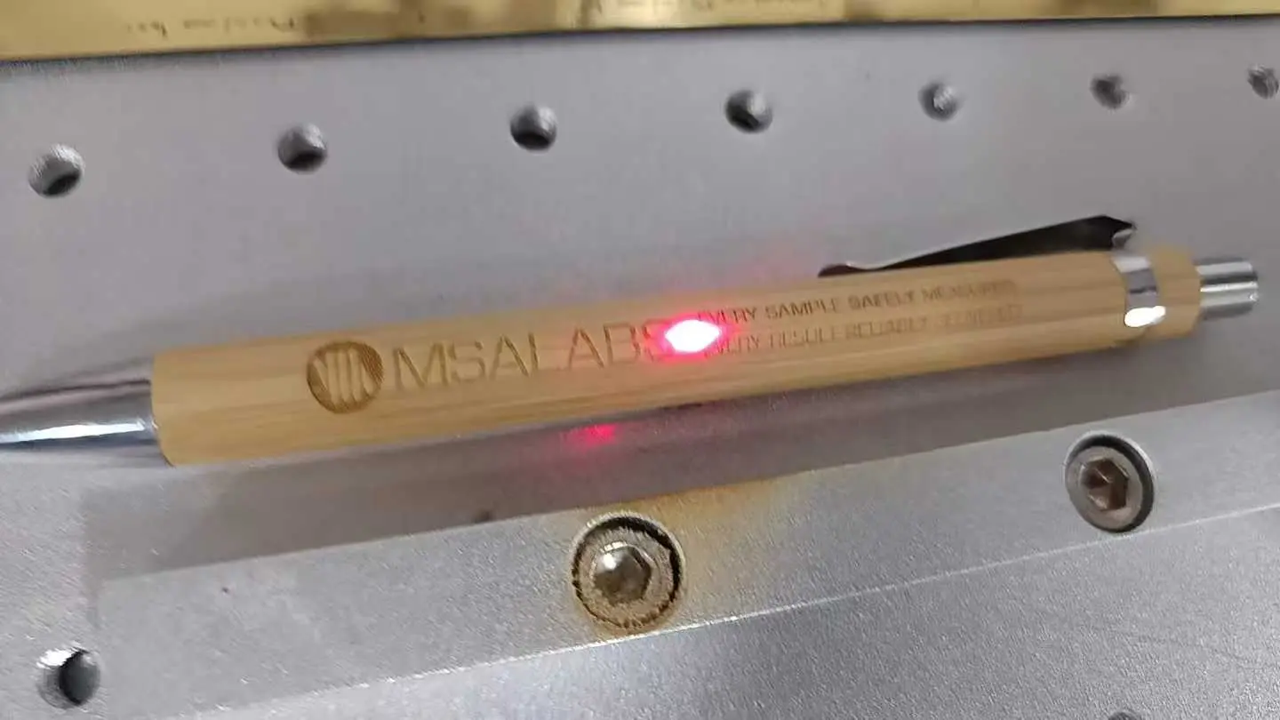 The Tanzanian customers are using UV laser marking machines to mark glass and pens
