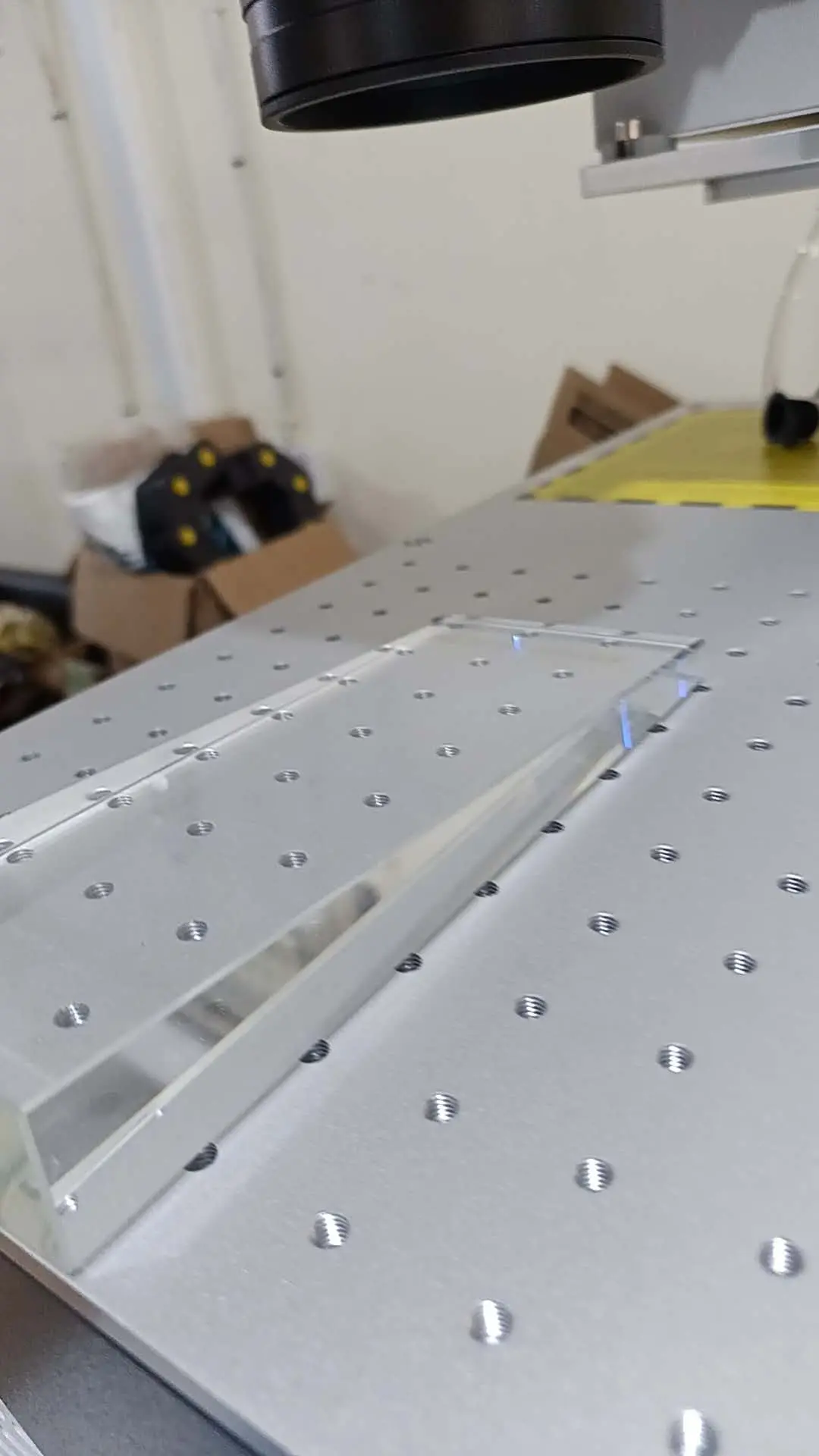 The Tanzanian customers are using UV laser marking machines to mark glass and pens