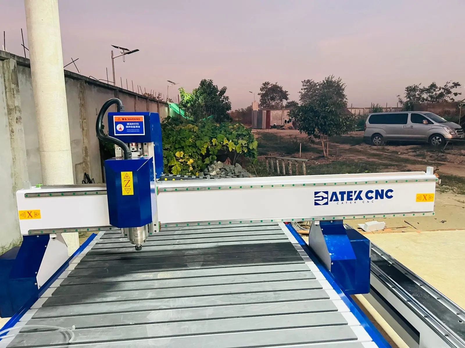 The Cambodian customer is assembling and testing a CNC wood router machine with a 4th-rotary axis.