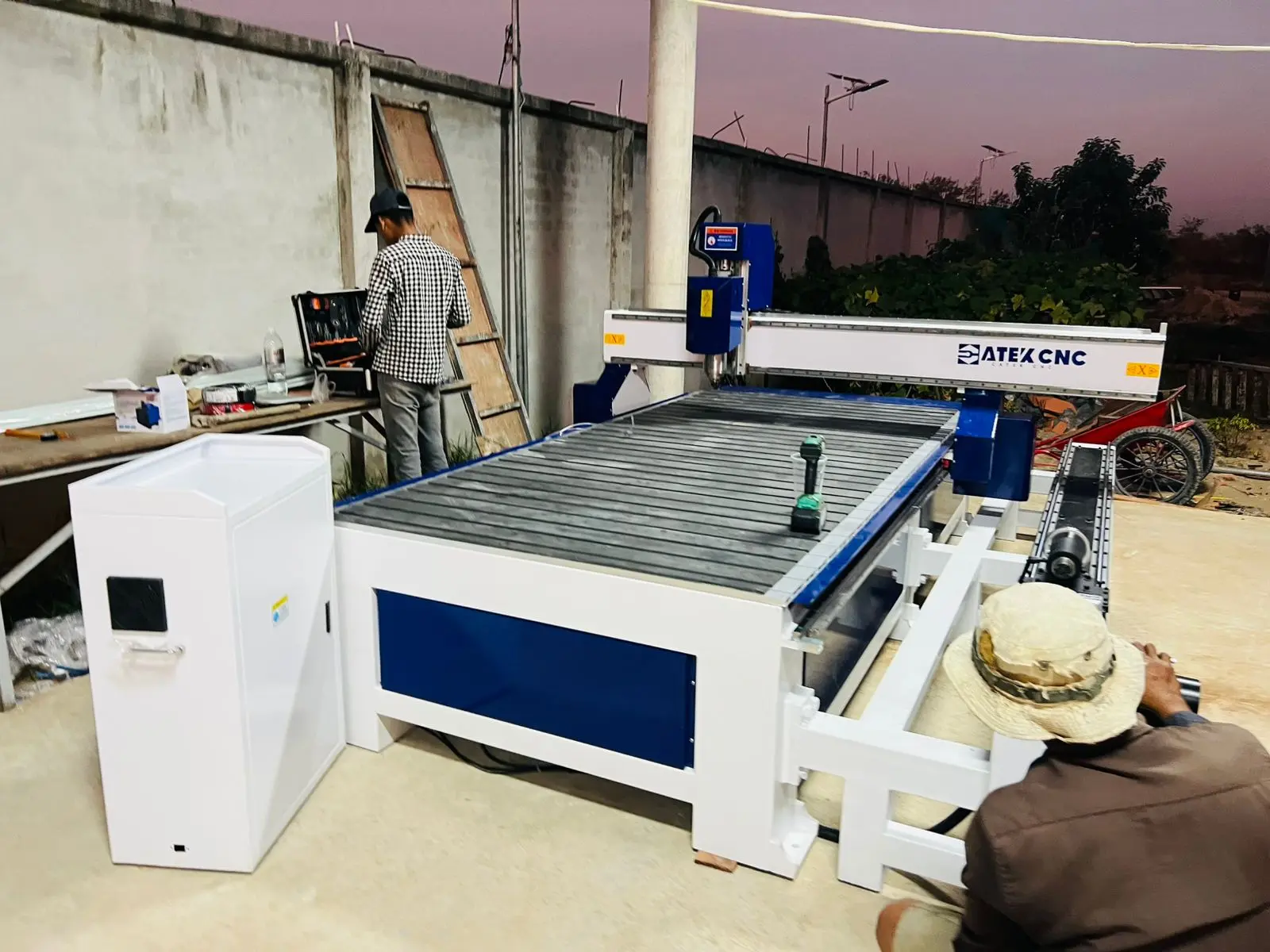 The Cambodian customer is assembling and testing a CNC wood router machine with a 4th-rotary axis.