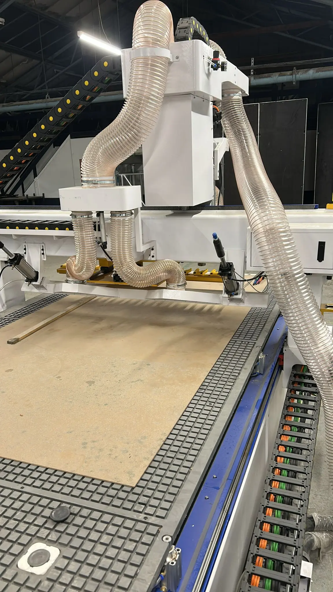 The UK customer is installing and commissioning a Model 1540-T ATC CNC woodw router machine