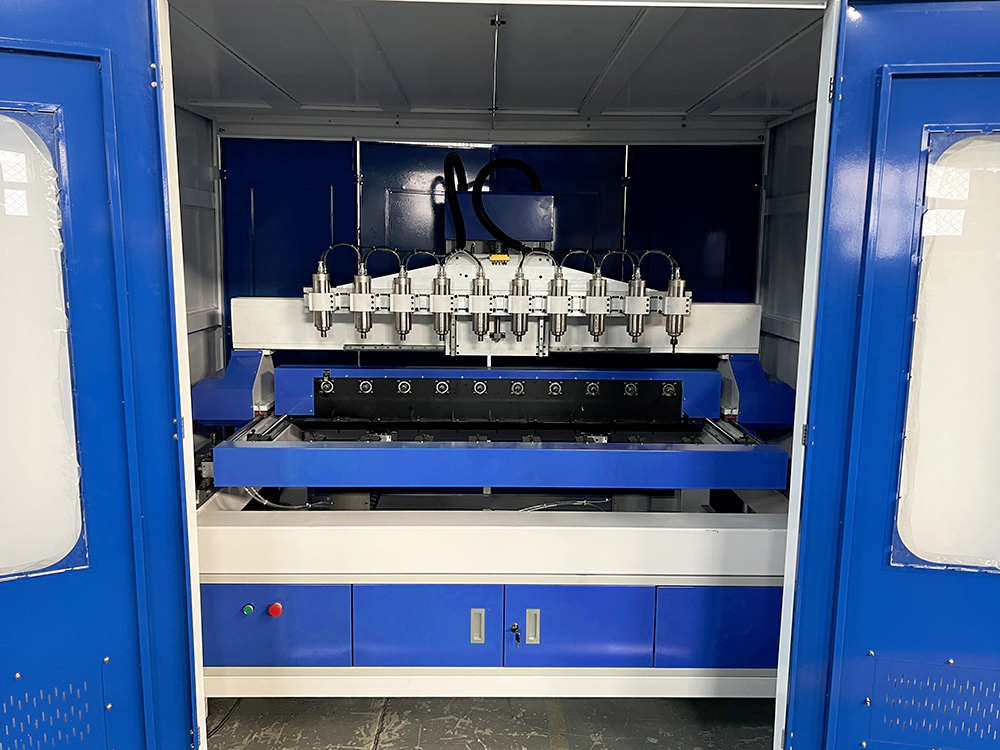 Multi-station 3D CNC Router with full safety enclosure Multi-station 3D CNC Router with full safety enclosure