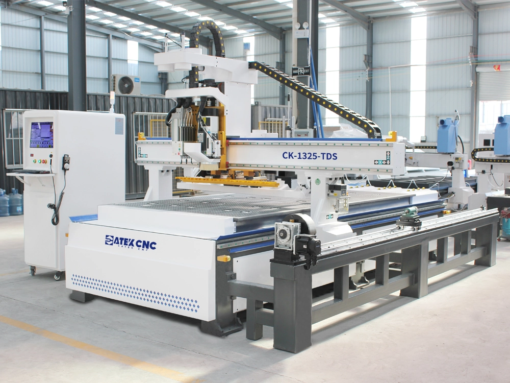 Front left view of linear ATC CNC nesting machine with 5+4 pneumatic drilling unit and 3D rotary axis Front left view of linear ATC CNC nesting machine with 5+4 pneumatic drilling unit and 3D rotary axis