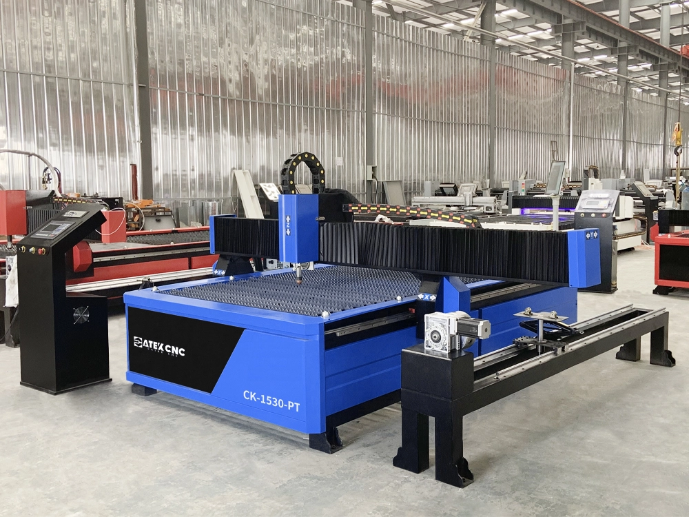 Front left view of 5x10 CNC plasma cutting machine with 4th rotary axis Front left view of 5x10 CNC plasma cutting machine with 4th rotary axis