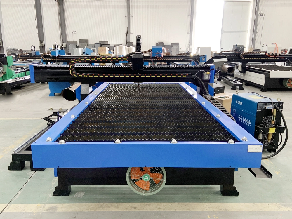 Rear view of 5x10 CNC plasma cutting machine with 4th rotary axis Rear view of 5x10 CNC plasma cutting machine with 4th rotary axis