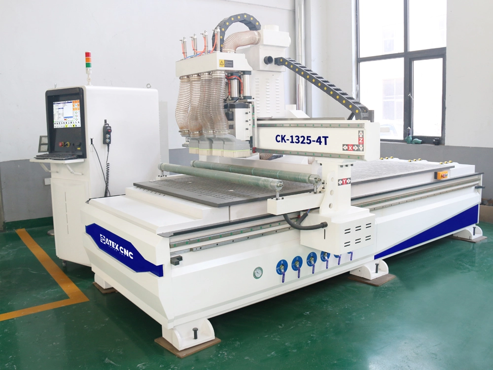 Front left view of CNC router with four switchable spindle Front left view of CNC router with four switchable spindle