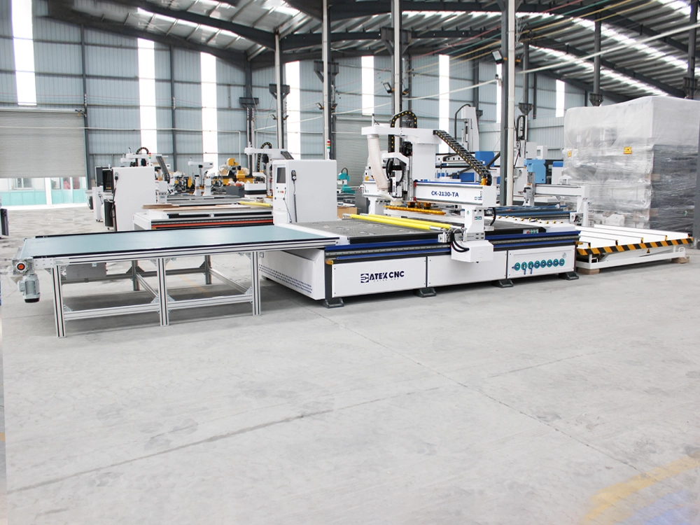Side view of 7x10ft ATC CNC router with automatic loading and unloading Side view of 7x10ft ATC CNC router with automatic loading and unloading