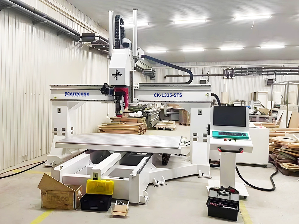 Bridge-type five-axis CNC router with movable tabletop Bridge-type five-axis CNC router with movable tabletop