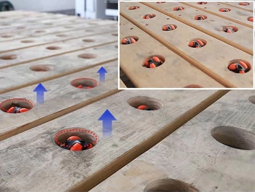 The universal wheels on the workbench can be raised and lowered to roll the stone plates above the workbench The universal wheels on the workbench can be raised and lowered to roll the stone plates above the workbench