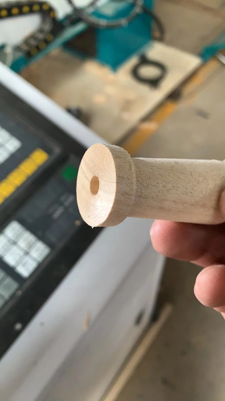 The Chilean customer used an automatic feeding CNC wood lathe to process wooden handles