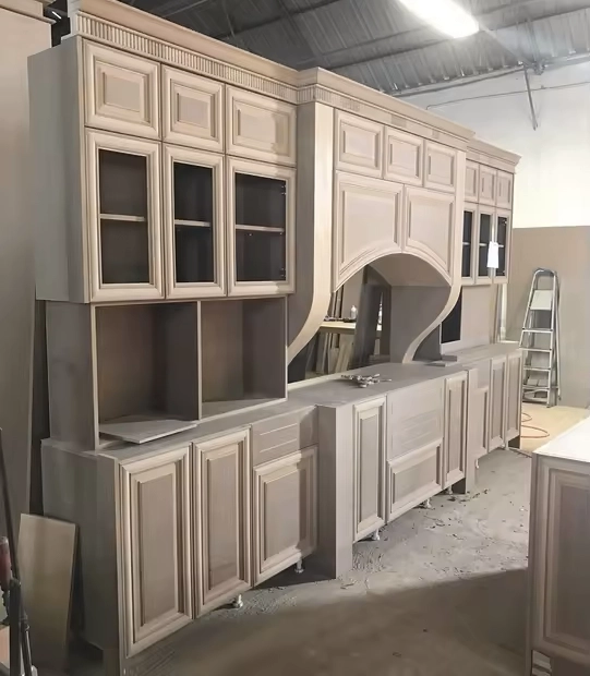 The American customers used a CNC wood router machine with a caarousel tool change and automatic loading and unloading to process cabinets