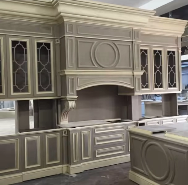 The American customers used a CNC wood router machine with a caarousel tool change and automatic loading and unloading to process cabinets