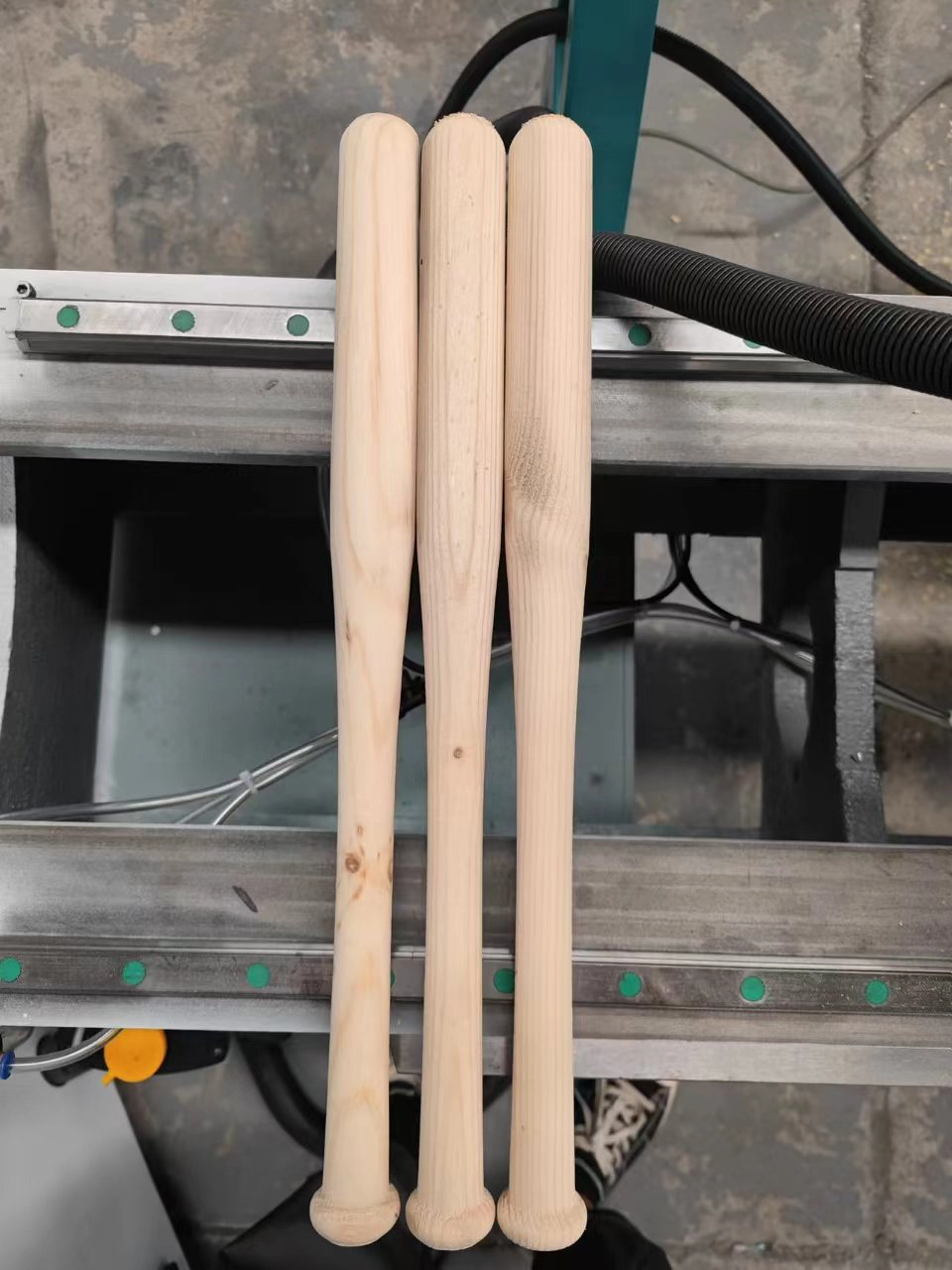 The American customers use CK-1530 CNC woodworking lathe to process baseball bats